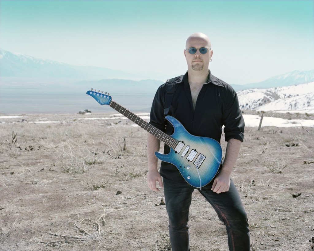 Vreny in the desert with blue guitar, a photo by top-photographer Pascal Demeester