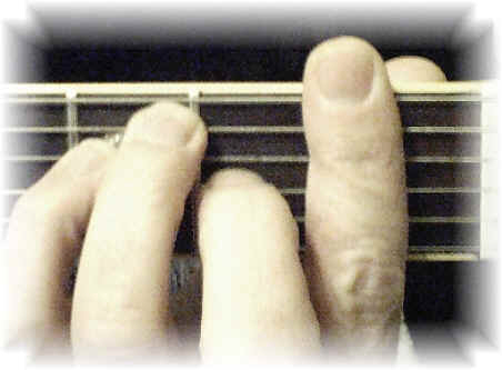 picture showing how to finger a bar chord