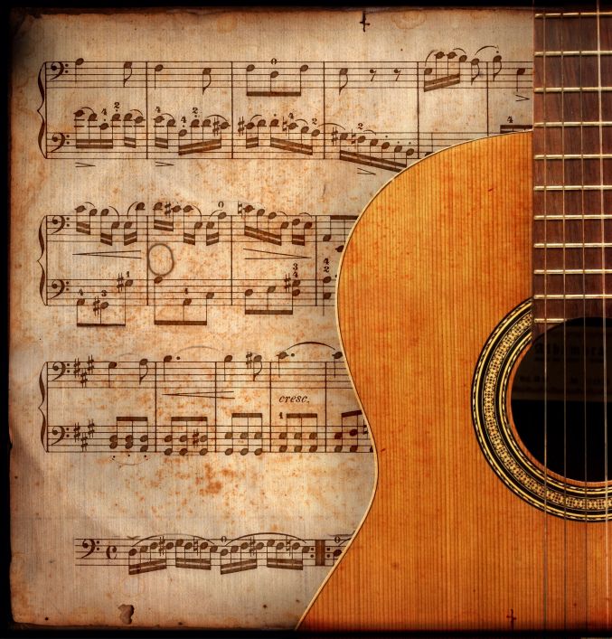 Music notation and an acoustic guitar