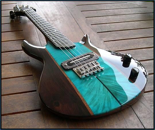 Deep teal with dark brown is not my favorite color combination for a guitar