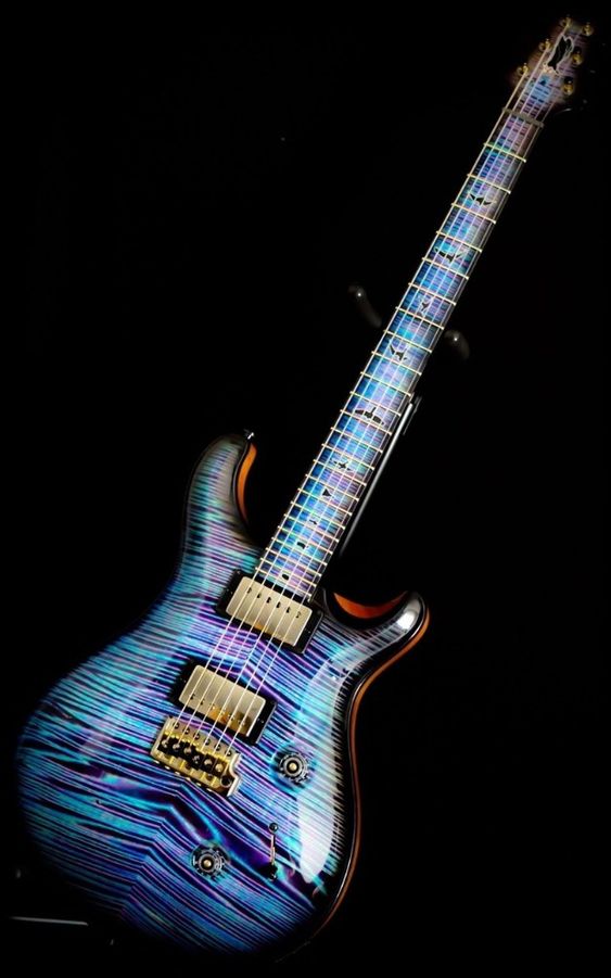 Guitar with shiny neon blue and purple stripes