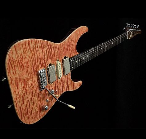 A Tom Anderson Strat model with quilted maple body and rootbeer like finish