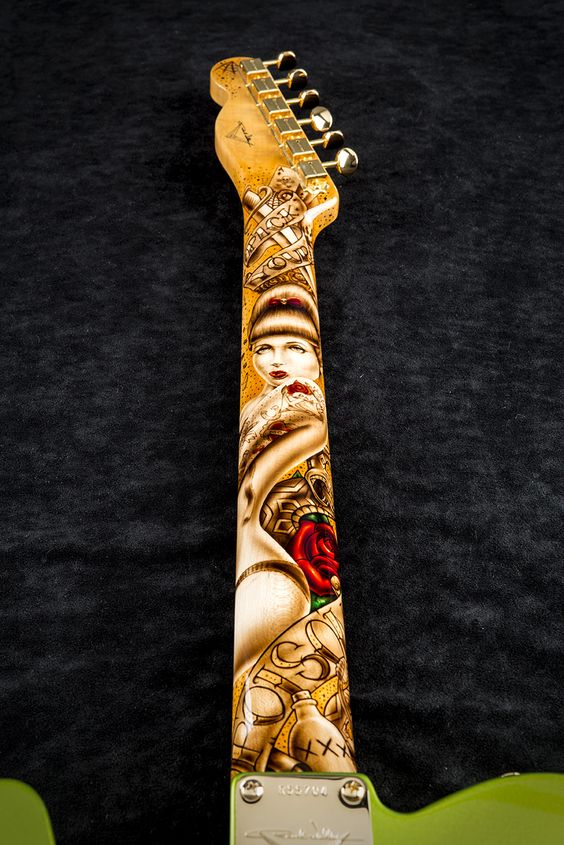 Astounding tattoo-like graphics on the back of a Tele neck