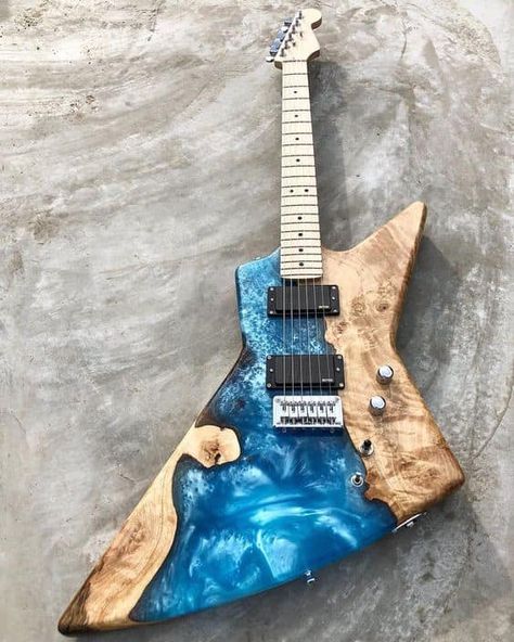 Look at that amazingly shiny swirly blue and natural wood combination that makes up this guitar body