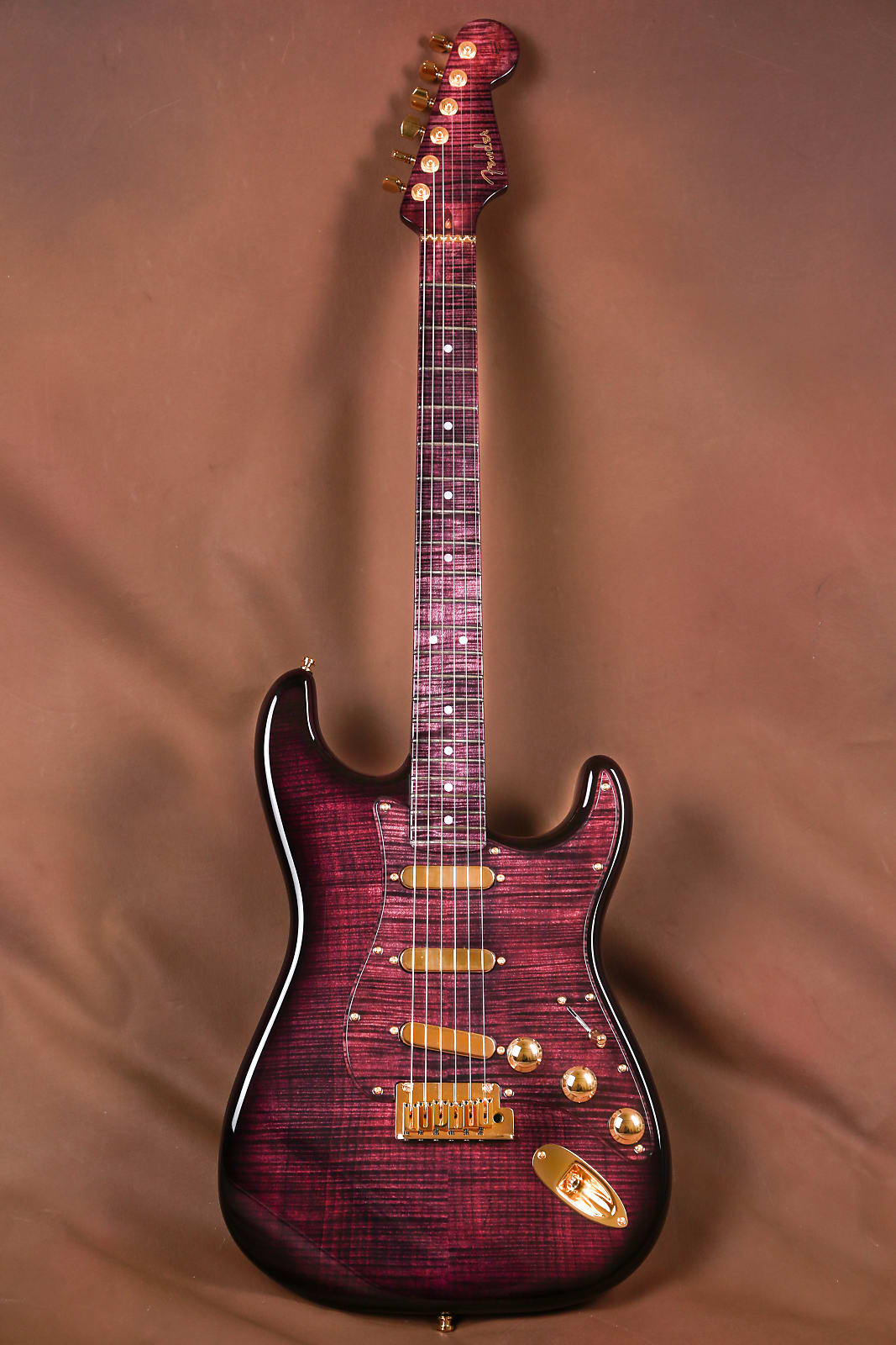 Everything is purple on this guitar, except for the hardware and pick ups, which are all gold