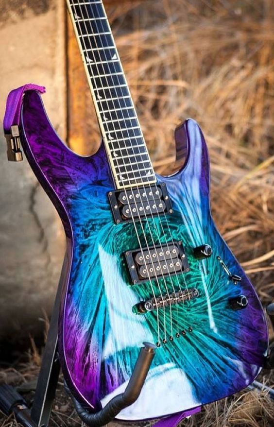 Look at the lively burl wood flames of this guitar underneath the multi-color burst finish. 
