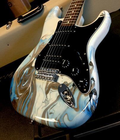 The drip swirl finish on this guitar has a pastel feel to it. 