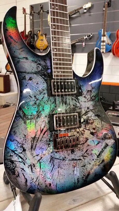 Look at that uniquely special paint job. I think this might be a Suhr Modern