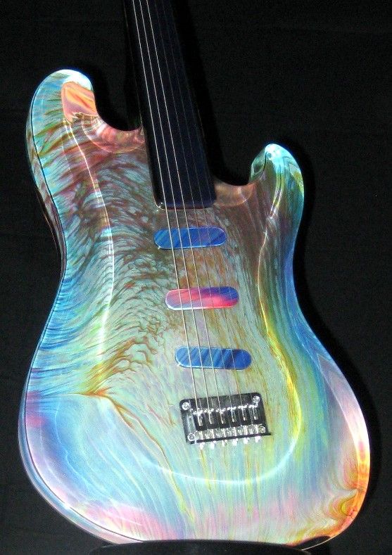 The neon-pastel colored guitar even has painted pick ups