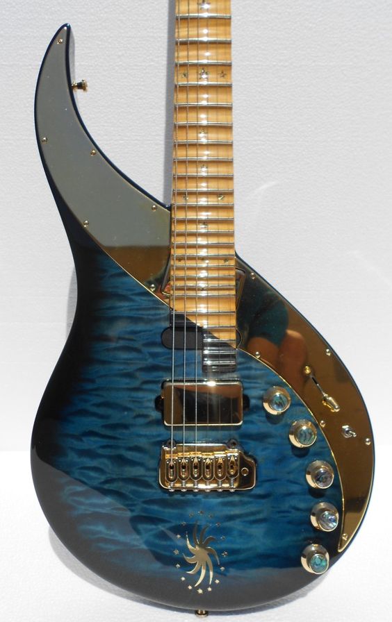 Can you guess who plays this unique guitar with its striking design, and over 3 octaves of frets? 
