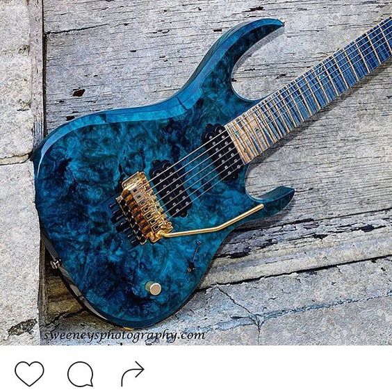 I love burl wood guitars. They feel and look so alive. Blue and gold is always a winner