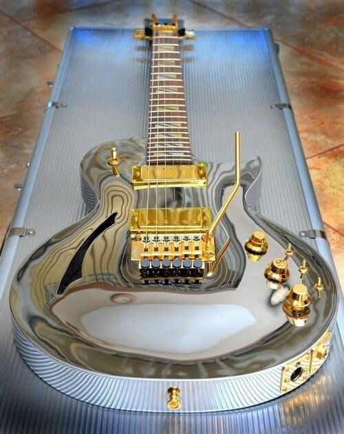A very shiny, silver and gold Les Paul