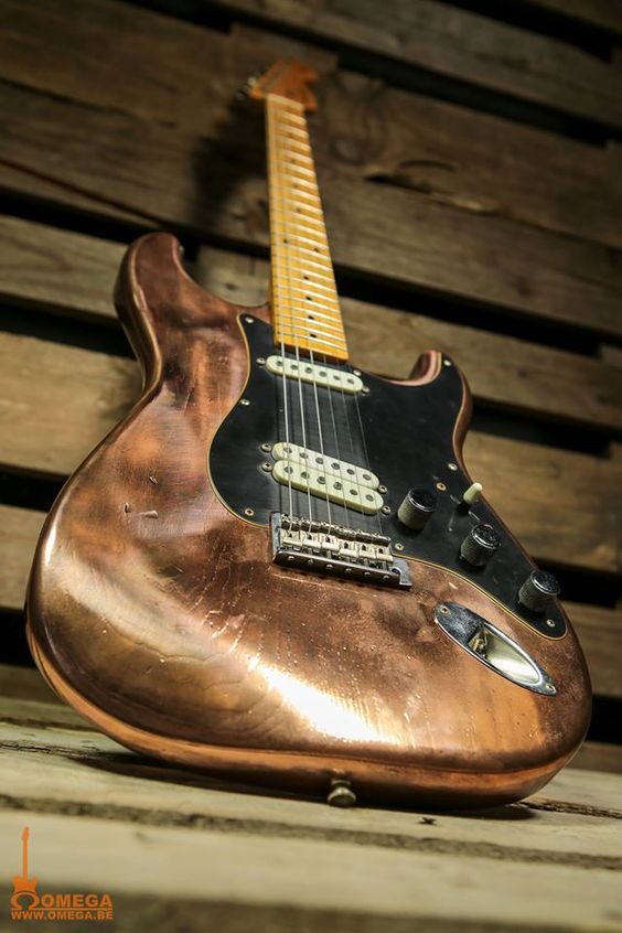 The shiny bronze on this Strat is timeless, just not sure about the black pickguard and cream pick ups