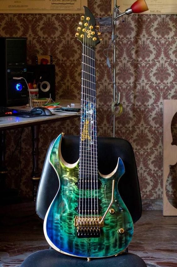 The blue-green color on this swirly quilt or burl maple top, reminds me of the Aurora Borealis 