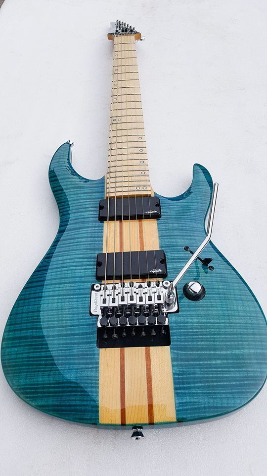 An elegant neck-through-design guitar, with gorgoues maple flames coming through the deep blue finishg