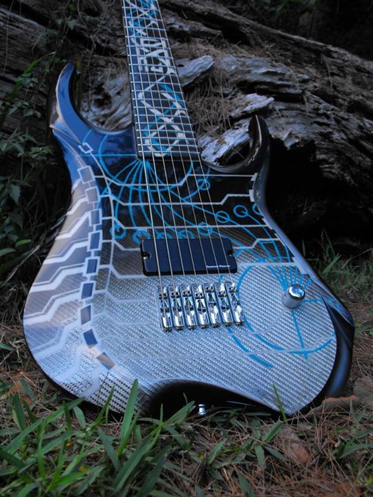 A futuristic guitar with an an engineering themed paint job