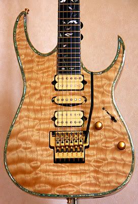 Gorgeous guitar with Natural Quilt maple Finish and pearl binding