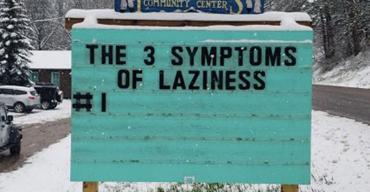 A billboard saying "The 3 symptoms of laziness", #1 