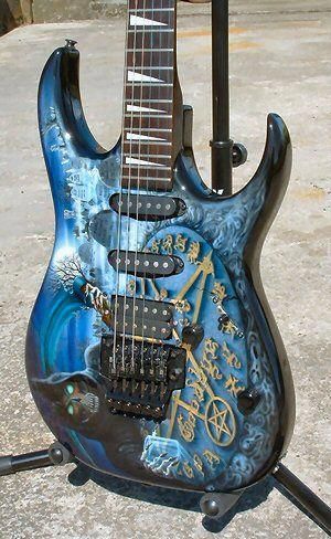 Occult symbolism themed blue guitar with a magnificent paint job. 