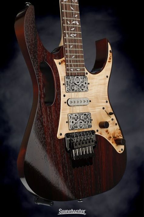 Retro Vintage dark Ibanez Guitar with Steve Vai grip handle, engraved pick up covers, and gorgeous natural wood pick guard