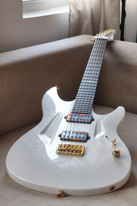 I LOVE white guitars. All white, gold hardware, distressed multi color metal pick up covers