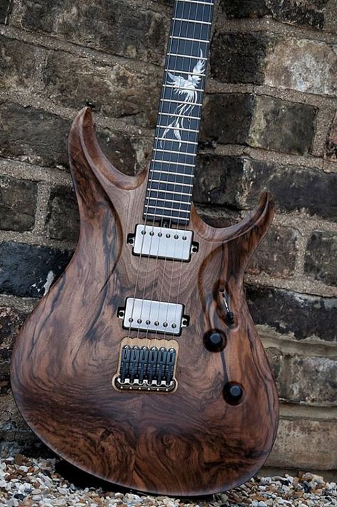 Trans natural wood finish guitar with elaborately card body