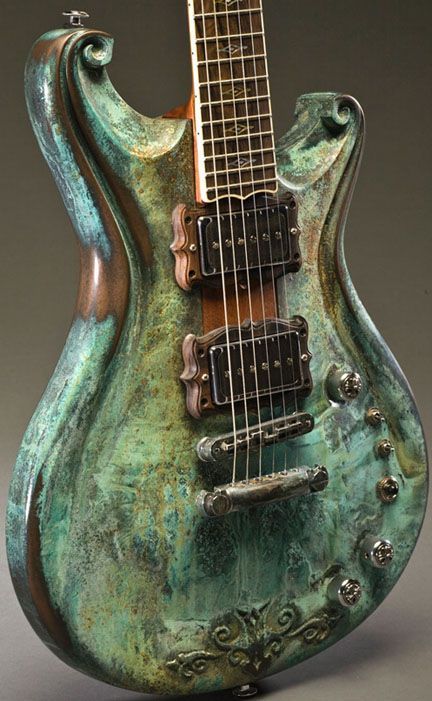 A green stained copper guitar body