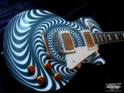 A Swirly blue spiral paint job on guitar