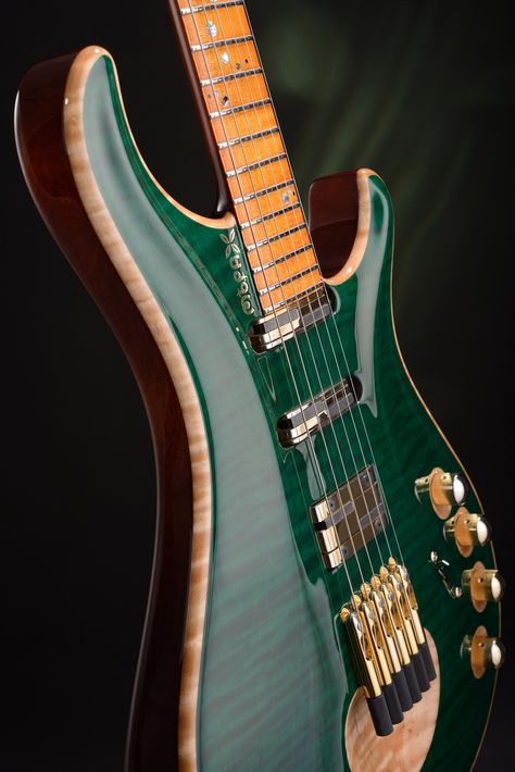 A gorgeous carved-top transparent green guitar with gold hardware. 