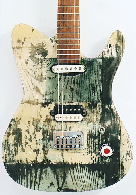 Green and Cream white colored paint areas on this Telecaster guitar