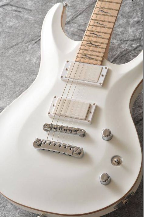 white carve-top super Strat with white pick up covers