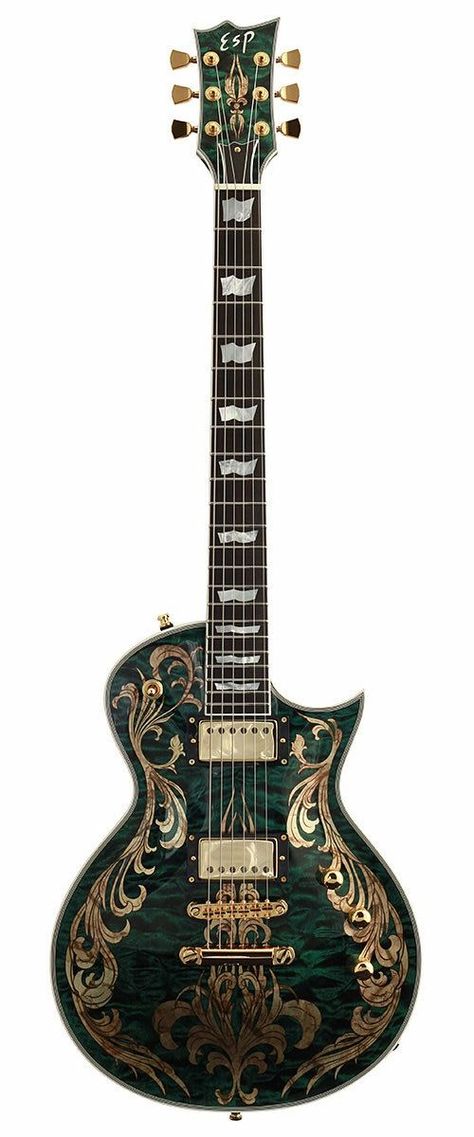 An eye-catching color combination: deep green body, quilted maple waves, and gold plant like inlays along the edges of the guitar