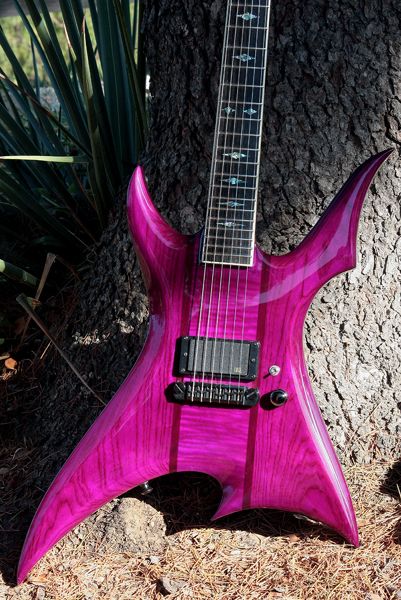 A veritable metal guitarist's guitar. BC Rich type shape, dark pink with black hardware. 