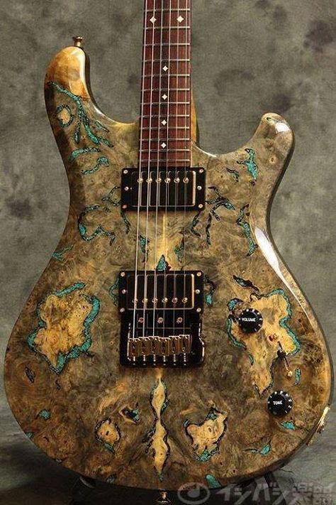 The combination of organic mustard color with burl wood grain, gives this guitar a very relaxing, soothing feel