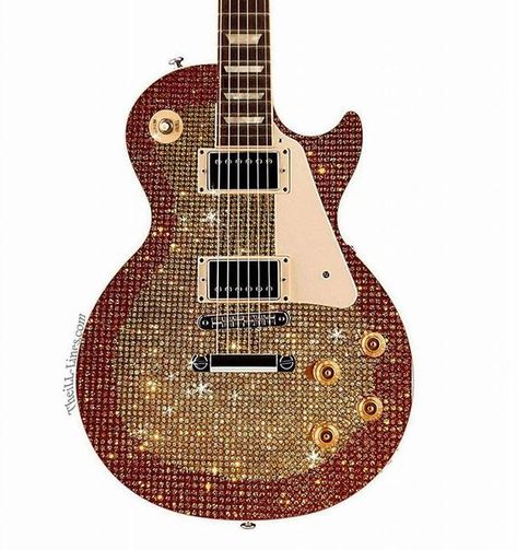 A golden glitter ball sparkly Les Paul with chrome hardware, and off white pick guard
