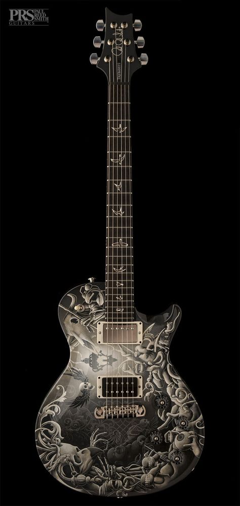 Black PRS guitar with silvery greyish yellowish dusky dramatic skulls and wings paint job